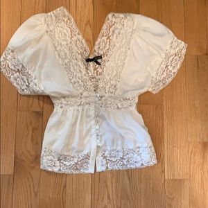 Cream colored v neck shirt